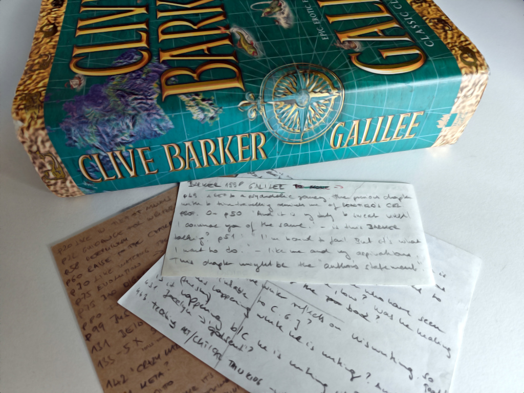 Photo of the book with my notes on paper in front.