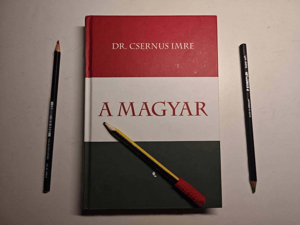 Photo of the book with pencils.